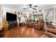Open living room area with views of the screened lanai and serene decor at 7339 Thomas St, Englewood, FL 34224