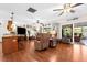 Spacious living room with bar top overlooking the kitchen and sliding door to lanai at 7339 Thomas St, Englewood, FL 34224