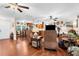 Inviting living room with ceiling fans and view of the kitchen at 7339 Thomas St, Englewood, FL 34224