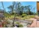 Picturesque backyard featuring lush greenery, mature trees, and a serene setting, perfect for outdoor activities at 745 Sesame St, Englewood, FL 34223