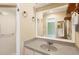 Bathroom vanity with gray countertop and large mirror at 745 Sesame St, Englewood, FL 34223
