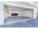 Spacious two-car garage with high ceilings and storage racks for kayaks at 7820 Manasota Key Rd, Englewood, FL 34223