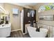 Updated bathroom with a freestanding tub, walk-in shower, and stylish fixtures at 8784 Mystic Cir, North Port, FL 34287