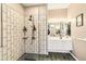 Modern bathroom featuring a glass shower enclosure, elegant fixtures, and contemporary design at 8784 Mystic Cir, North Port, FL 34287