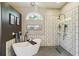 This primary bathroom features a soaking tub, walk-in shower, and modern fixtures at 8784 Mystic Cir, North Port, FL 34287