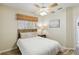 Inviting bedroom offering a ceiling fan, a window with a woven shade, and a calm ambiance at 8784 Mystic Cir, North Port, FL 34287