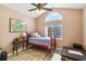 Cozy bedroom features a vaulted ceiling and arched window at 8784 Mystic Cir, North Port, FL 34287