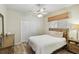 Comfortable bedroom with a ceiling fan, closet, and neutral tones that create a relaxing atmosphere at 8784 Mystic Cir, North Port, FL 34287