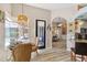Bright breakfast nook features wood-look floors and sliding doors leading to the pool at 8784 Mystic Cir, North Port, FL 34287