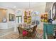 Dining room featuring colorful decor, seating for six, and bright lighting at 8784 Mystic Cir, North Port, FL 34287
