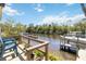 Enjoy waterfront living with a private dock, perfect for boating and enjoying the serene views at 8784 Mystic Cir, North Port, FL 34287