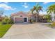 Lovely single-story home with a 2-car garage, mature landscaping, and a well-manicured lawn at 8784 Mystic Cir, North Port, FL 34287