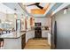 This light and bright kitchen features granite counters, modern appliances, and wood-look floors at 8784 Mystic Cir, North Port, FL 34287
