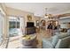 Open living space with tiled floors, pool view, and comfortable seating area at 8784 Mystic Cir, North Port, FL 34287
