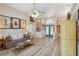 Cozy living room with a ceiling fan, light-colored walls, and natural light at 8784 Mystic Cir, North Port, FL 34287