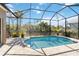 Screened pool provides a relaxing escape with scenic water views and a serene atmosphere at 8784 Mystic Cir, North Port, FL 34287
