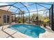 Enjoy the tranquility of this screened pool with waterfront views, a true outdoor oasis at 8784 Mystic Cir, North Port, FL 34287