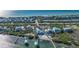 Captivating coastal aerial view displaying waterfront homes, serene beaches, and picturesque water features at 9 Peekins Cove Dr, Boca Grande, FL 33921