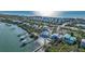 Stunning coastal home showcasing beautiful water views, private docks, and lush landscaping along the shoreline at 9 Peekins Cove Dr, Boca Grande, FL 33921