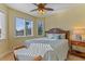 Comfortable bedroom with ceiling fan, natural light, and beachy decor and feel at 9 Peekins Cove Dr, Boca Grande, FL 33921