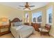 Bright bedroom featuring a ceiling fan, neutral colored walls, and lots of natural light at 9 Peekins Cove Dr, Boca Grande, FL 33921