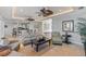 Open-concept living room showcasing a comfortable seating area, tile floors, and seamless flow into the kitchen area at 9 Peekins Cove Dr, Boca Grande, FL 33921