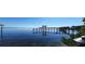 View of a serene waterway featuring a dock and covered platform, providing an ideal spot for waterfront enjoyment at 9 Peekins Cove Dr, Boca Grande, FL 33921