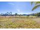 Explore this spacious backyard offering ample outdoor space with views of neighboring homes at 9219 Newnan Cir, Port Charlotte, FL 33981