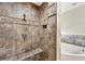 Close up of the tiled shower with built in niche and bench at 9219 Newnan Cir, Port Charlotte, FL 33981