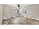 Cozy bedroom features tile flooring and ample natural light from shuttered windows at 9219 Newnan Cir, Port Charlotte, FL 33981