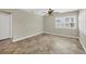 Spacious bedroom featuring tile flooring, ceiling fan, and ample closet space at 9219 Newnan Cir, Port Charlotte, FL 33981