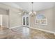 Elegant dining room with tile floors, high ceilings, and stylish chandeliers at 9219 Newnan Cir, Port Charlotte, FL 33981