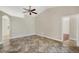 Spacious living room with tile flooring, neutral walls, and ceiling fan at 9219 Newnan Cir, Port Charlotte, FL 33981