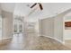 Bright, open-concept living space with tile floors, neutral paint, and elegant lighting fixtures at 9219 Newnan Cir, Port Charlotte, FL 33981