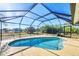 Enjoy this inviting screened-in pool with plenty of space to relax in a backyard setting at 9219 Newnan Cir, Port Charlotte, FL 33981