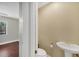 A powder room features a pedestal sink at 9219 Newnan Cir, Port Charlotte, FL 33981