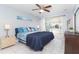 Comfortable main bedroom featuring a king bed and sliding doors to the sunroom at 9330 Migue Cir, Port Charlotte, FL 33981