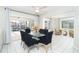Bright and airy dining area with views to the lanai and pool, perfect for enjoying meals with Gathering and friends at 9330 Migue Cir, Port Charlotte, FL 33981