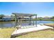 Private boat lift providing direct access to the water, with a sturdy construction and scenic waterfront views at 9330 Migue Cir, Port Charlotte, FL 33981