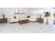 Inviting living room with neutral décor, tile floors, and stylish furnishings, creating a comfortable space at 9330 Migue Cir, Port Charlotte, FL 33981