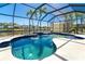 Cool off in this screened pool, with sun shelf, offering ultimate relaxation and recreation at 9330 Migue Cir, Port Charlotte, FL 33981