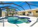 Enjoy swimming in this kidney-shaped pool featuring a sun shelf, and a screened-in lanai at 9330 Migue Cir, Port Charlotte, FL 33981