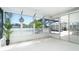 Bright sunroom with multiple windows, plant accents, and views of the pool at 9330 Migue Cir, Port Charlotte, FL 33981