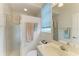 Bathroom featuring glass enclosed shower, modern vanity, and neutral accents at 10640 Ayear Rd, Port Charlotte, FL 33981