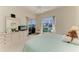 Bedroom with a water view, ceiling fan, dresser, and neutral decor at 10640 Ayear Rd, Port Charlotte, FL 33981