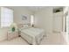 Comfortable bedroom featuring a queen-sized bed, neutral decor, and closet at 10640 Ayear Rd, Port Charlotte, FL 33981