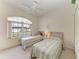 Bedroom with two twin beds and a bright window view at 10640 Ayear Rd, Port Charlotte, FL 33981