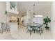 Bright dining area features a glass table, 6 chairs, and a chandelier at 10640 Ayear Rd, Port Charlotte, FL 33981