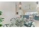 This dining area offers a glass table and views of the living room and pool at 10640 Ayear Rd, Port Charlotte, FL 33981