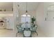 Dining area showcasing a glass table and 6 chairs with views into the kitchen at 10640 Ayear Rd, Port Charlotte, FL 33981